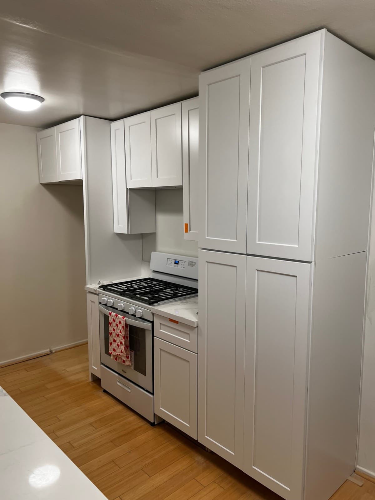 Kitchen with freshly painted white shaker cabinets
